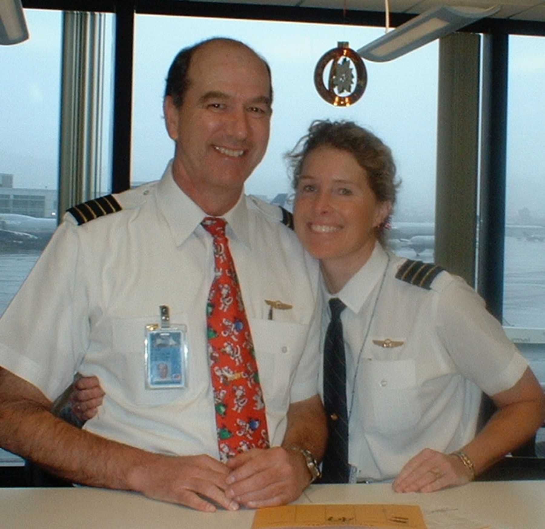 Owen Maddox in a commercial pilot uniform.